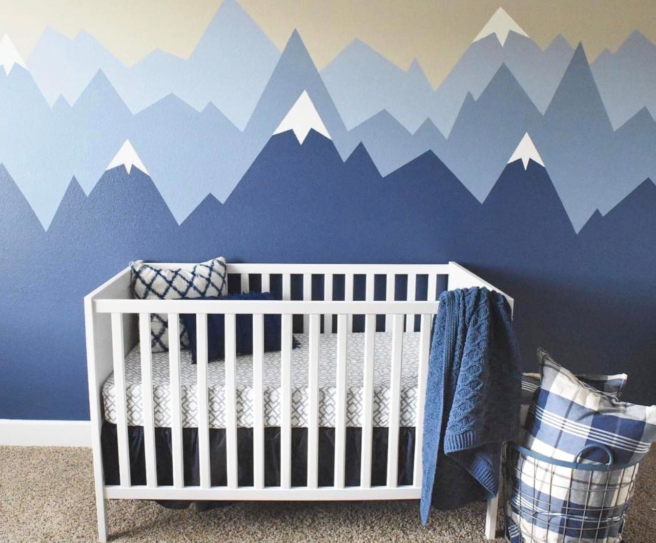 The cutest nursery with painted walls in the prettiest shades of blue!