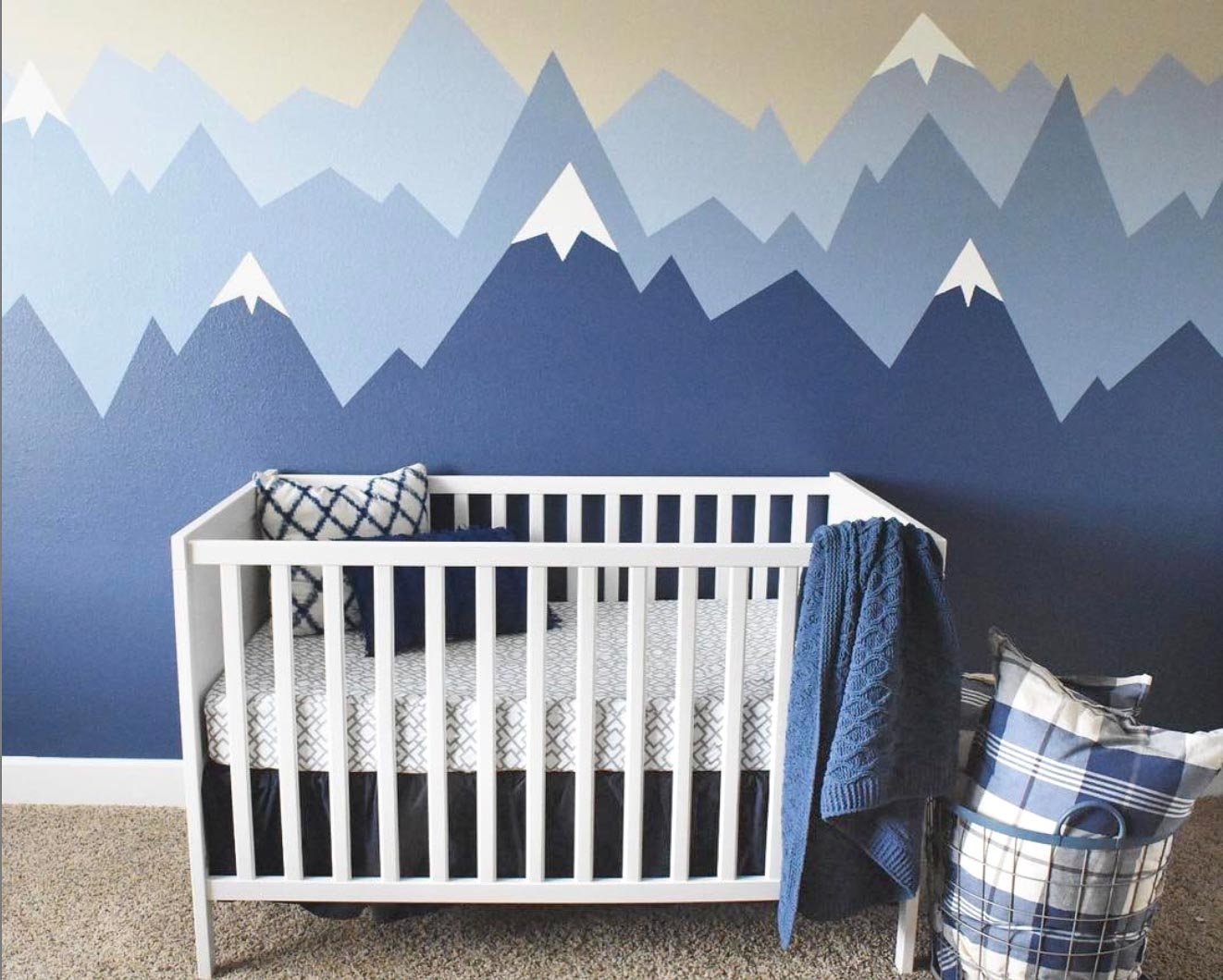 The cutest nursery with painted walls in the prettiest shades of blue!