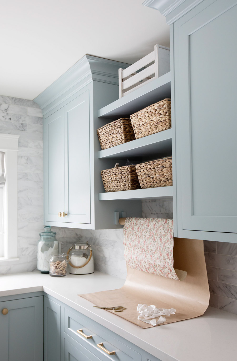 A GORGEOUS blue paint color - from Jillian Harris' laundry room!