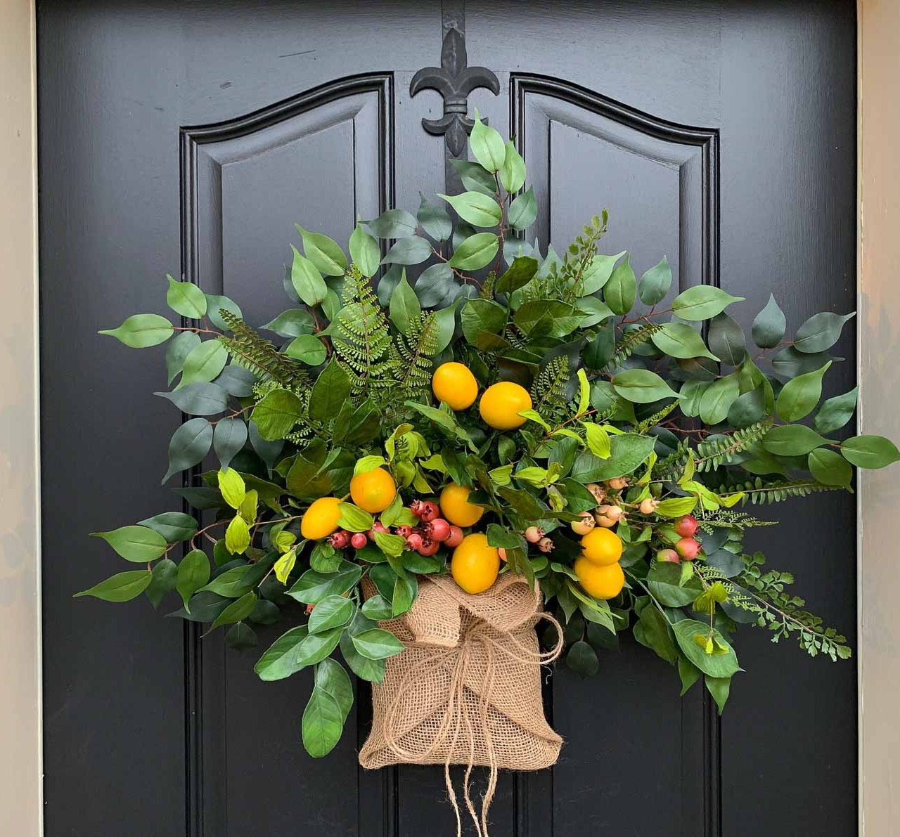 Love this spring "wreath" that looks like a colorful burlap wrapped bouquet!
