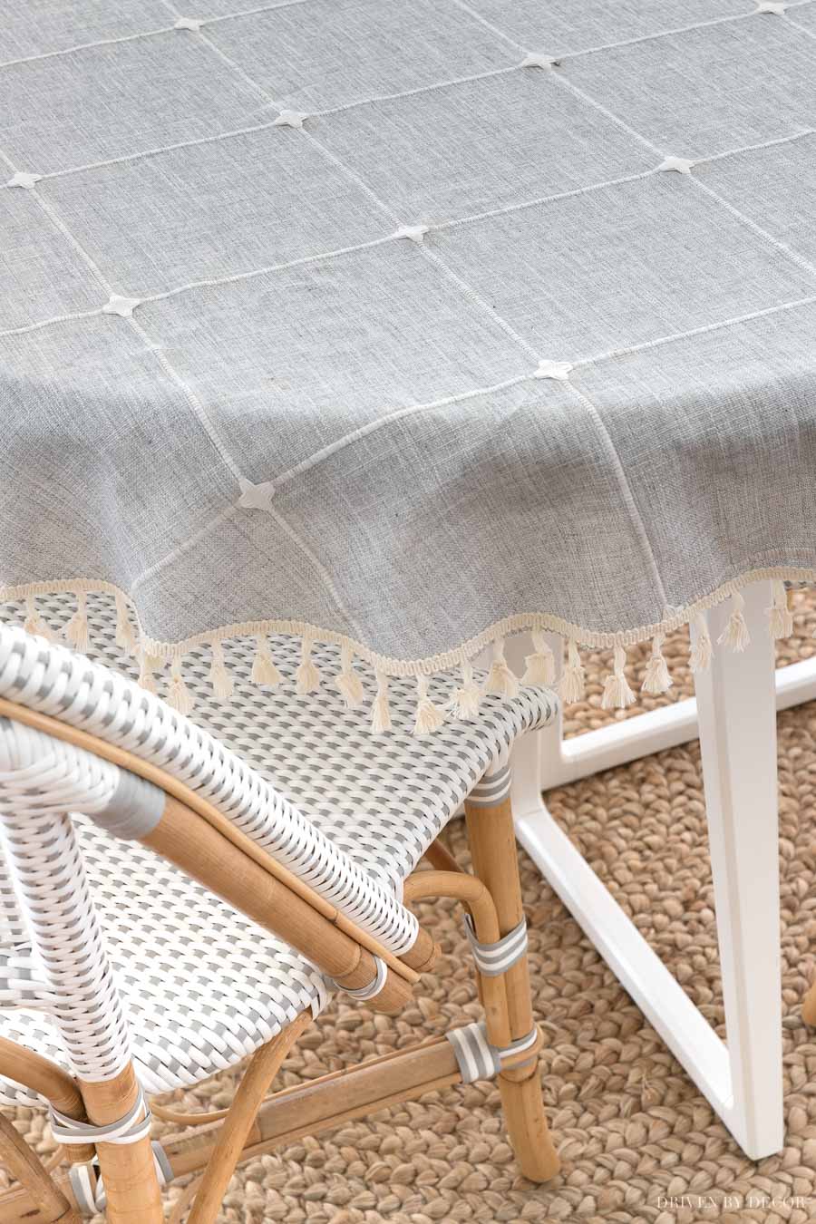 A super cute tasseled tablecloth on this breakfast nook table!