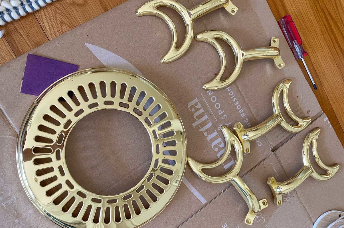 The brass ceiling fan parts that I spray painted white!