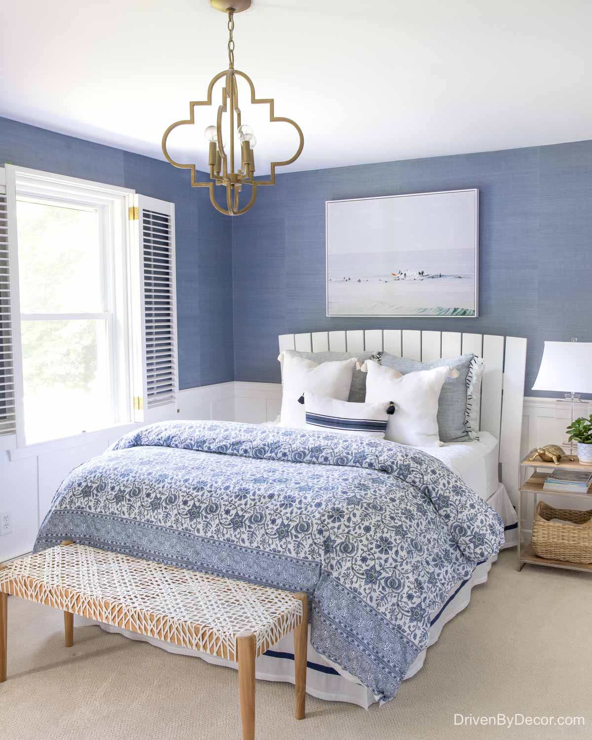 Love the end of bed bench in this blue and white bedroom!n