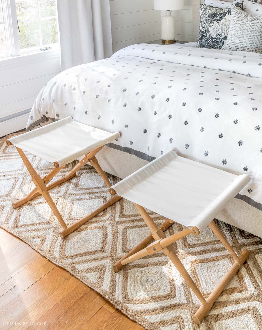 Instead of a bench at the end of the bed, I love the look of two stools like this!