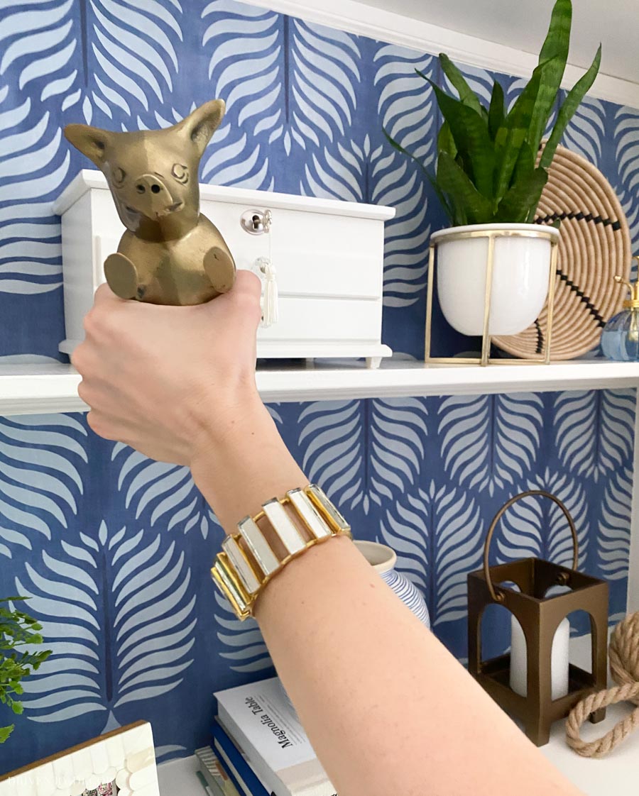 The cutest accessories for shelves - love the brass pig bookend!