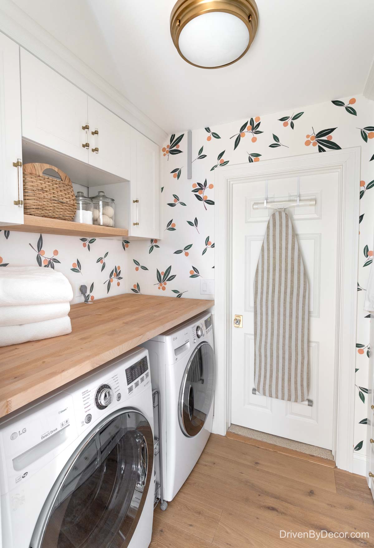 Ironing board hanging on the back of a laundry room door