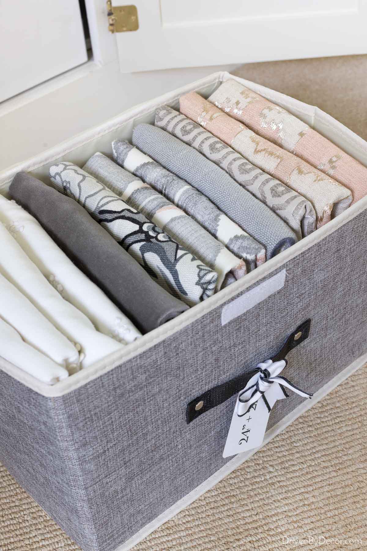 Pillow covers folded and stored in fabric storage box