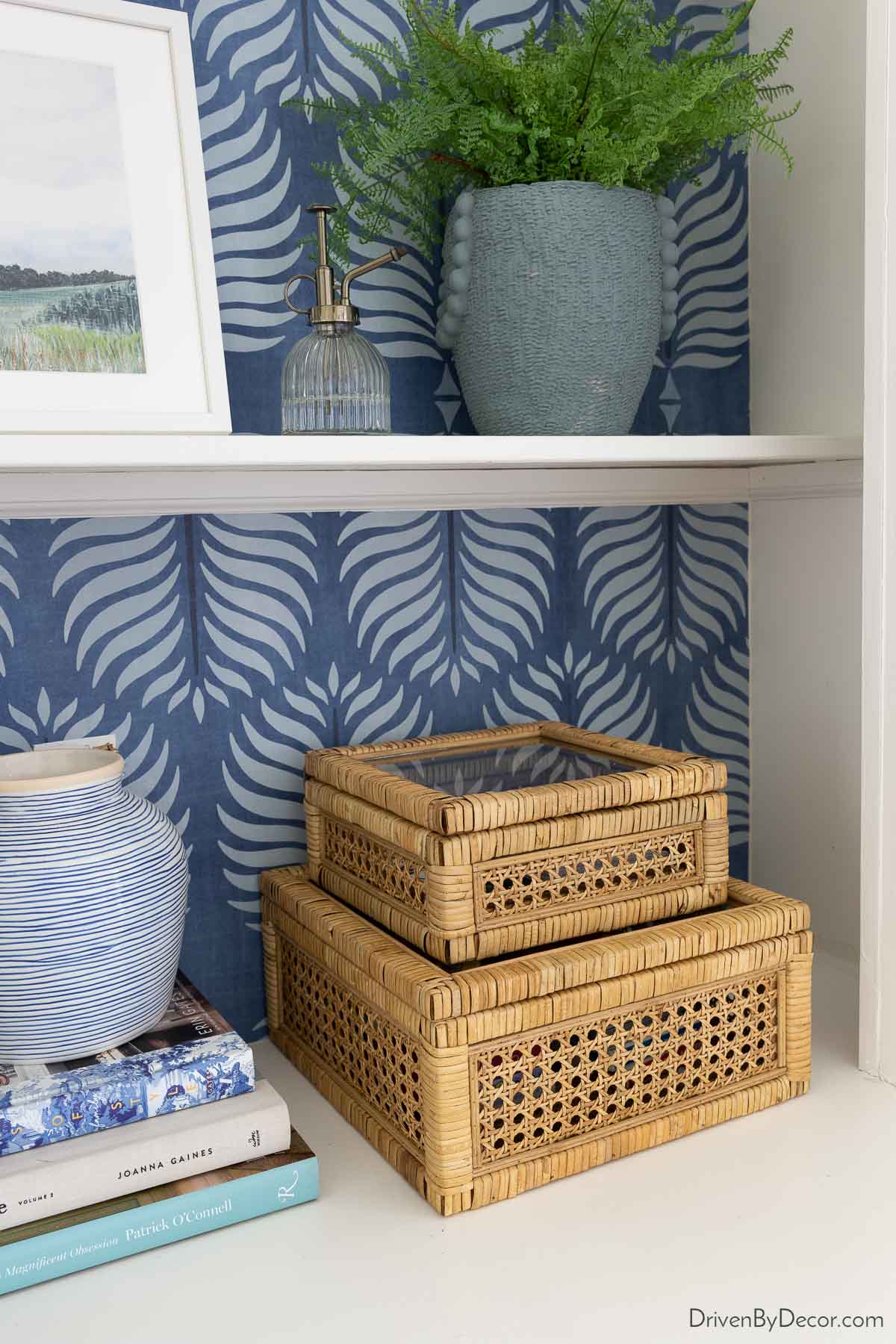 Pair of rattan boxes on bookcase shelves