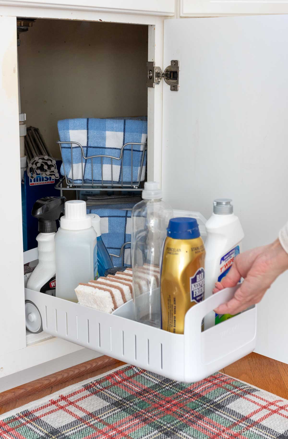 Rolling organizer that pulls out from under the sink for storage of kitchen supplies