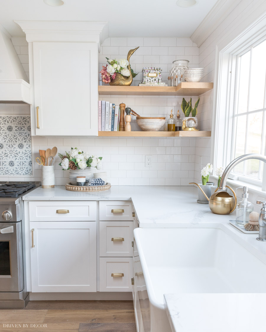 Our open kitchen shelves filled with cookbooks, serving pieces, and decorative accents!