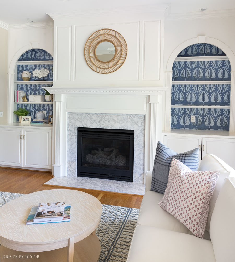 The wallpapered bookcases in our living room!