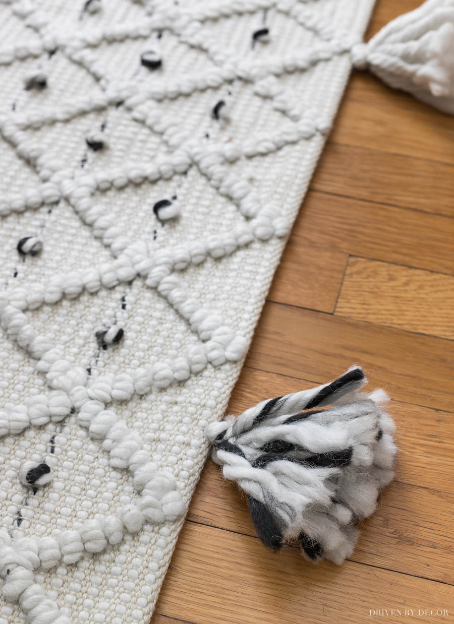 LOVE the tassels on this cute rug in her home office!!