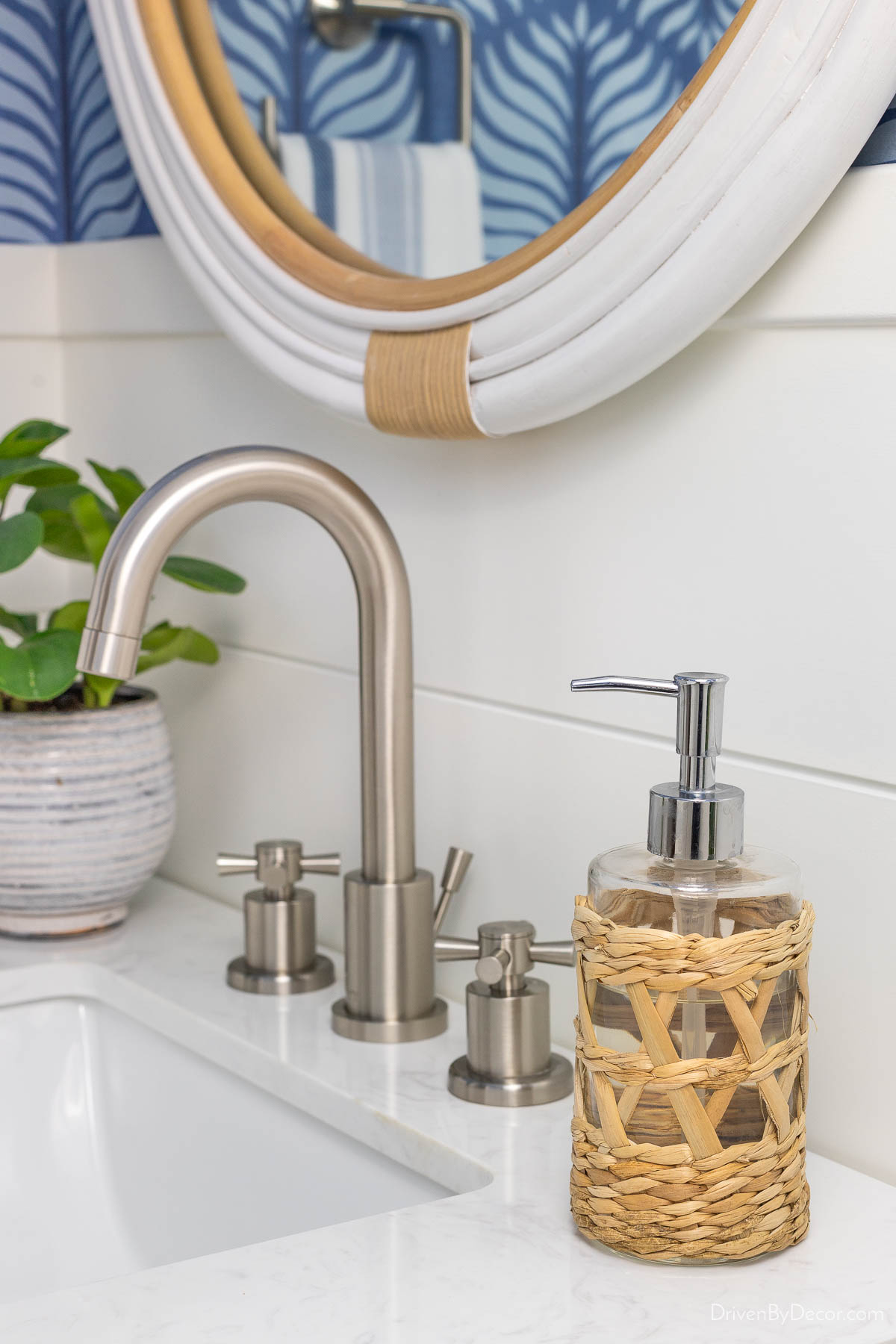 Rattan soap pump as bathroom decor in powder room