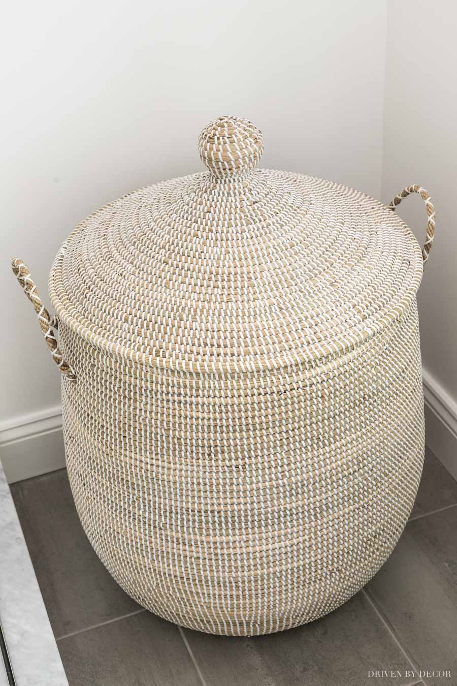 The prettiest basket to use as a hamper! One of the beautiful bathroom decor ideas in this post!