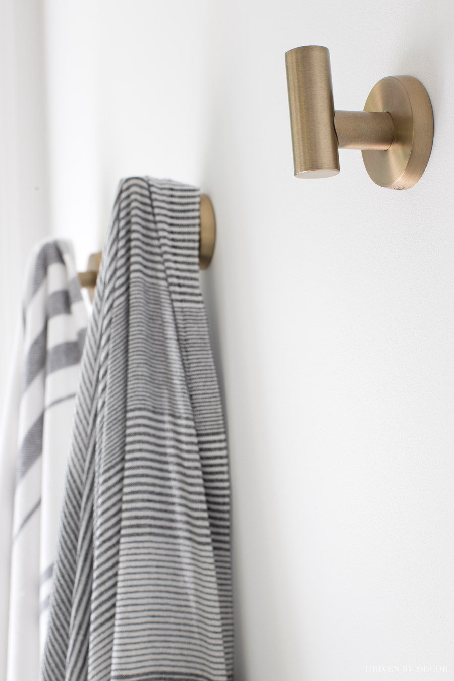 Such pretty brass towel hooks in this master bathroom!