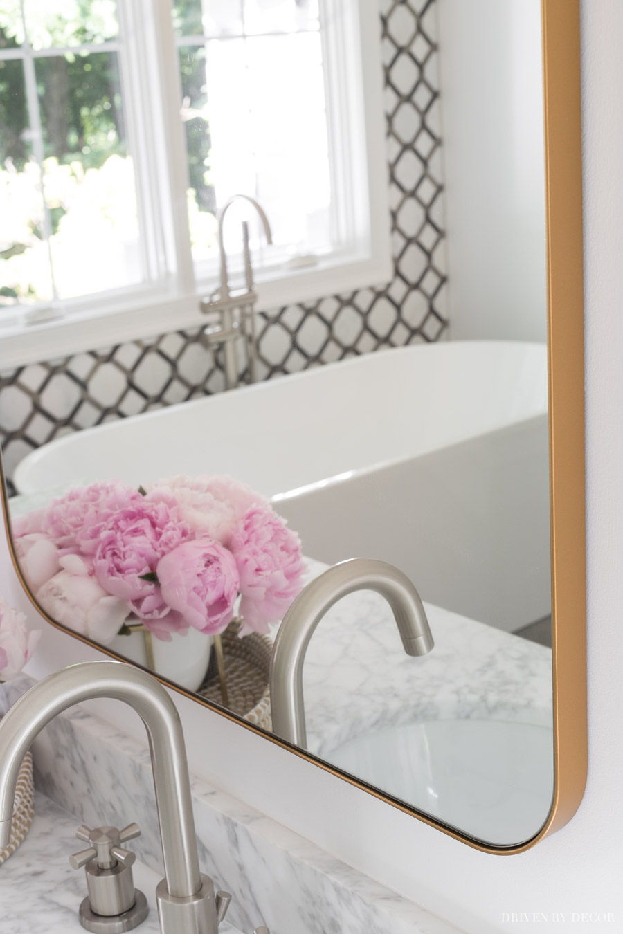 Love the design of this large bathroom mirror with a thin gold edge