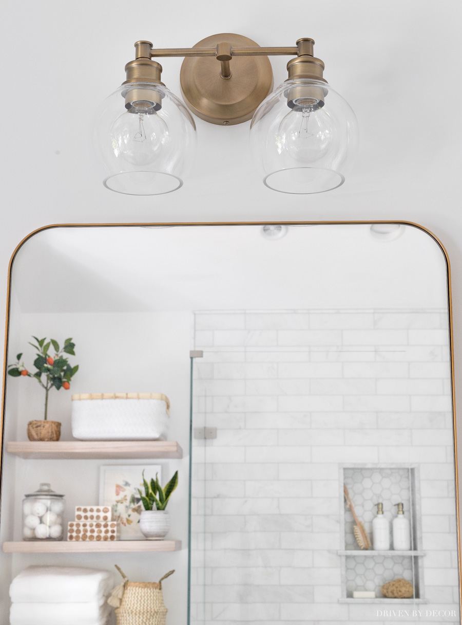 Love the globe lights on this gorgeous brass 2-light vanity light!