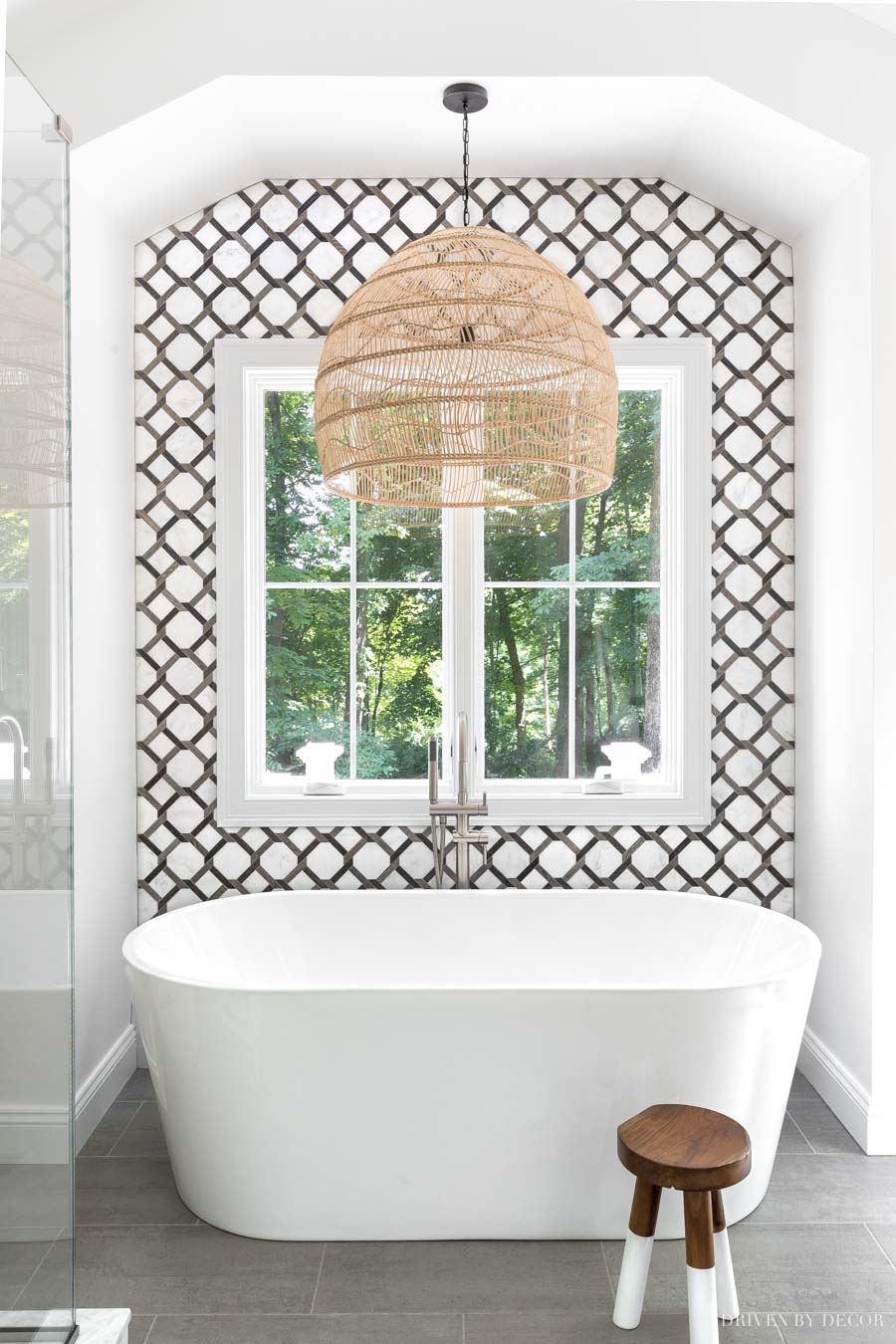 The freestanding tub in our master bathroom with a stunning statement-making tile wall!