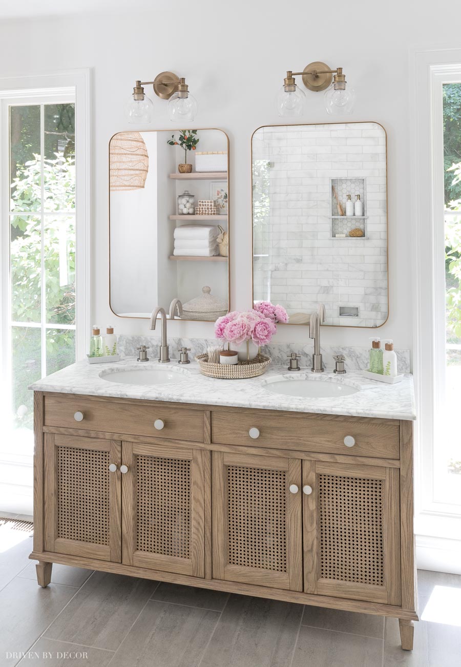 What a gorgeous wood double vanity! Love the caned doors!