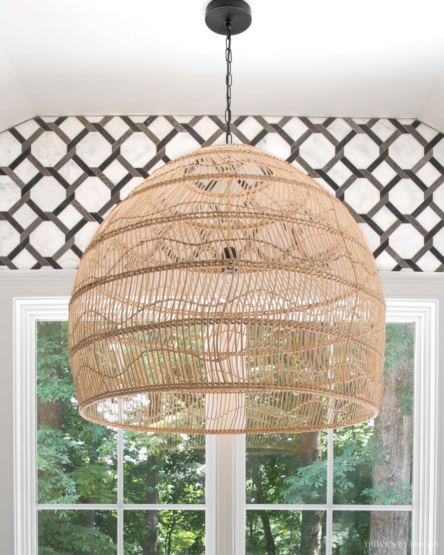 LOVE this large rattan pendant over the bathtub in her master bathroom!