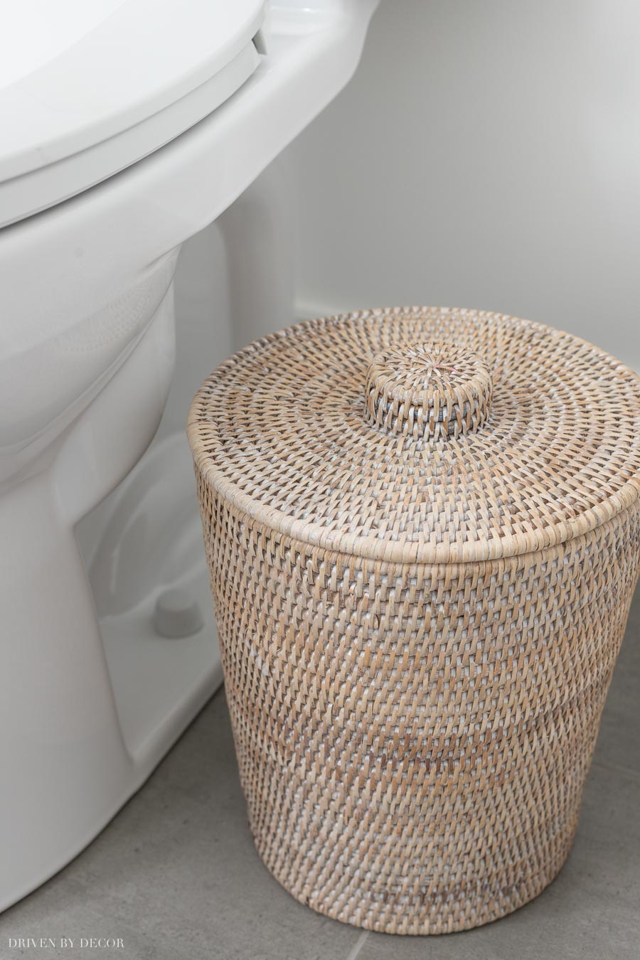 Cute rattan trash can that comes with a plastic liner inside!