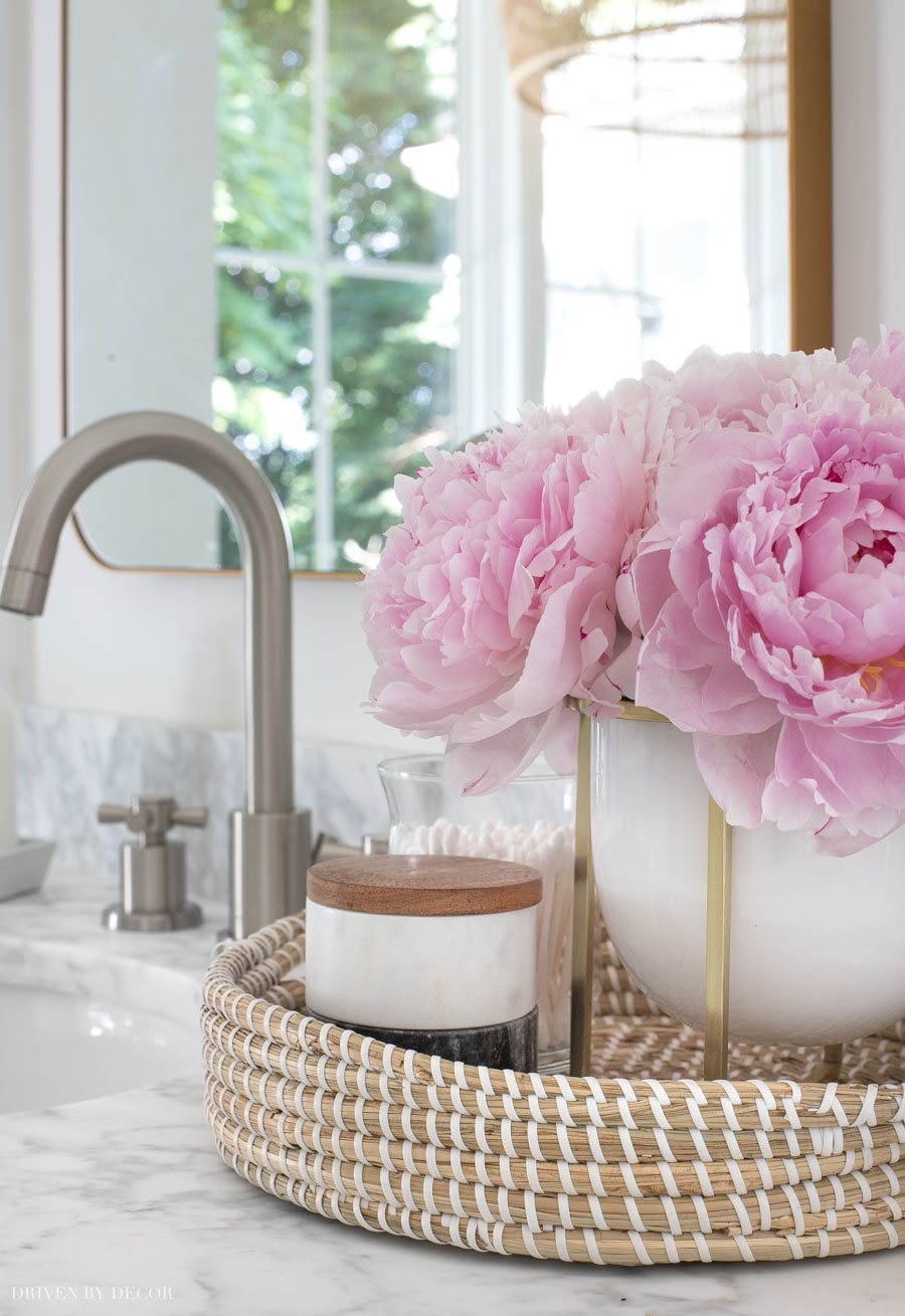 Small woven tray that fits perfectly between the sinks on our double bathroom vanity!