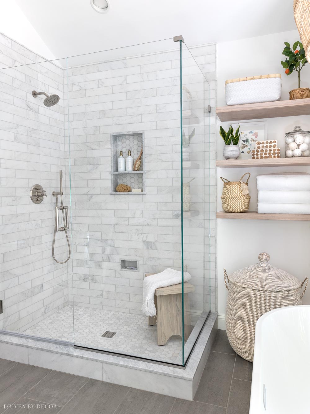 LOVE these floating wood shelves we installed in our master bathroom!