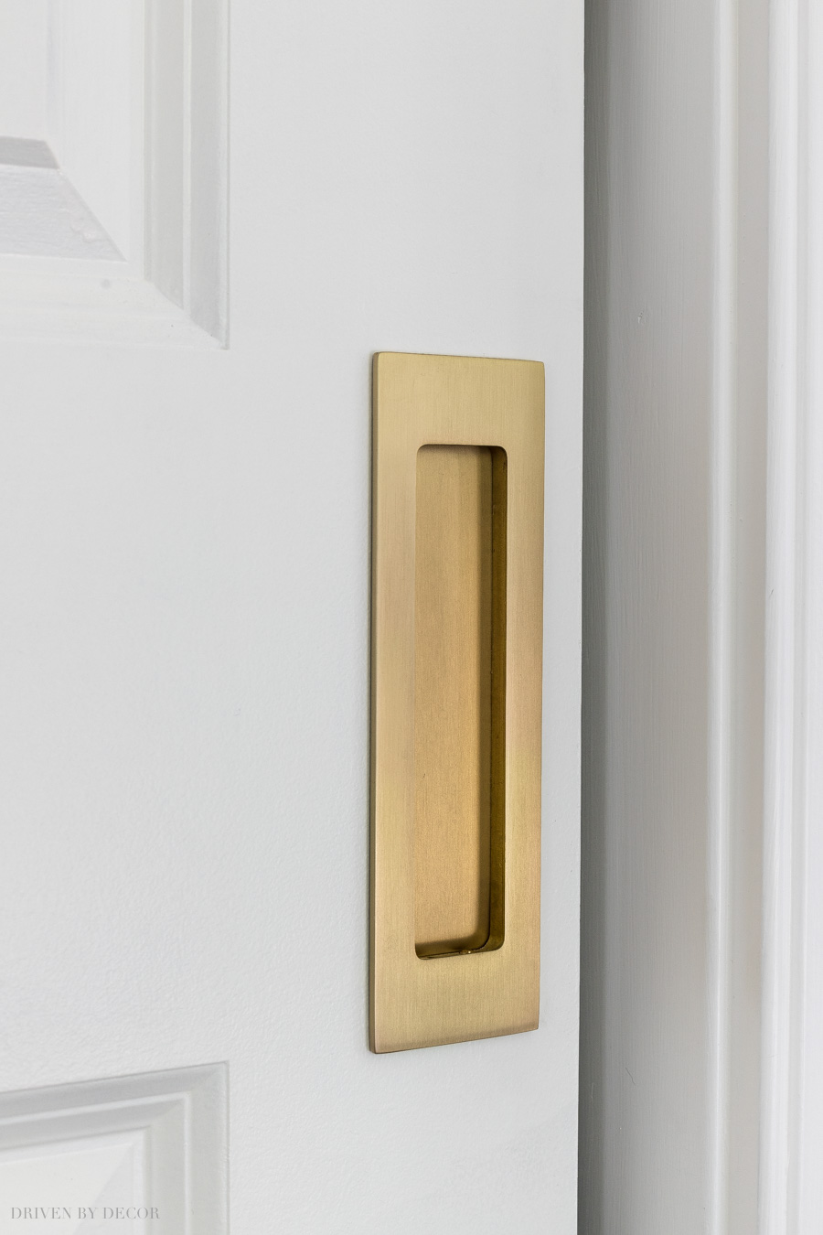 Love this pocket door upgrade! She used a rectangular satin brass pull on the door to their walk-in closet.