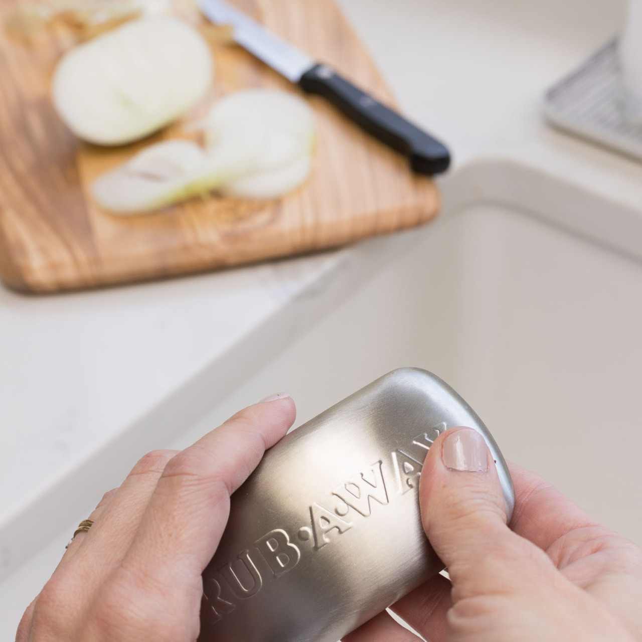 No clue how it works but it takes away the smell of onions and other gross smells from your hands!