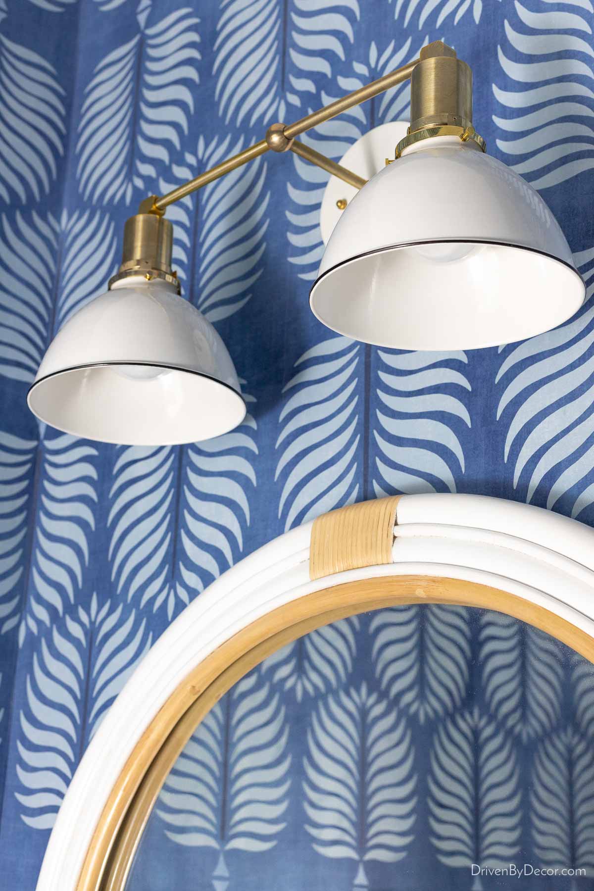 My 25 Best Etsy Home Decor Finds! Two-light brass and white bathroom sconce over round mirror