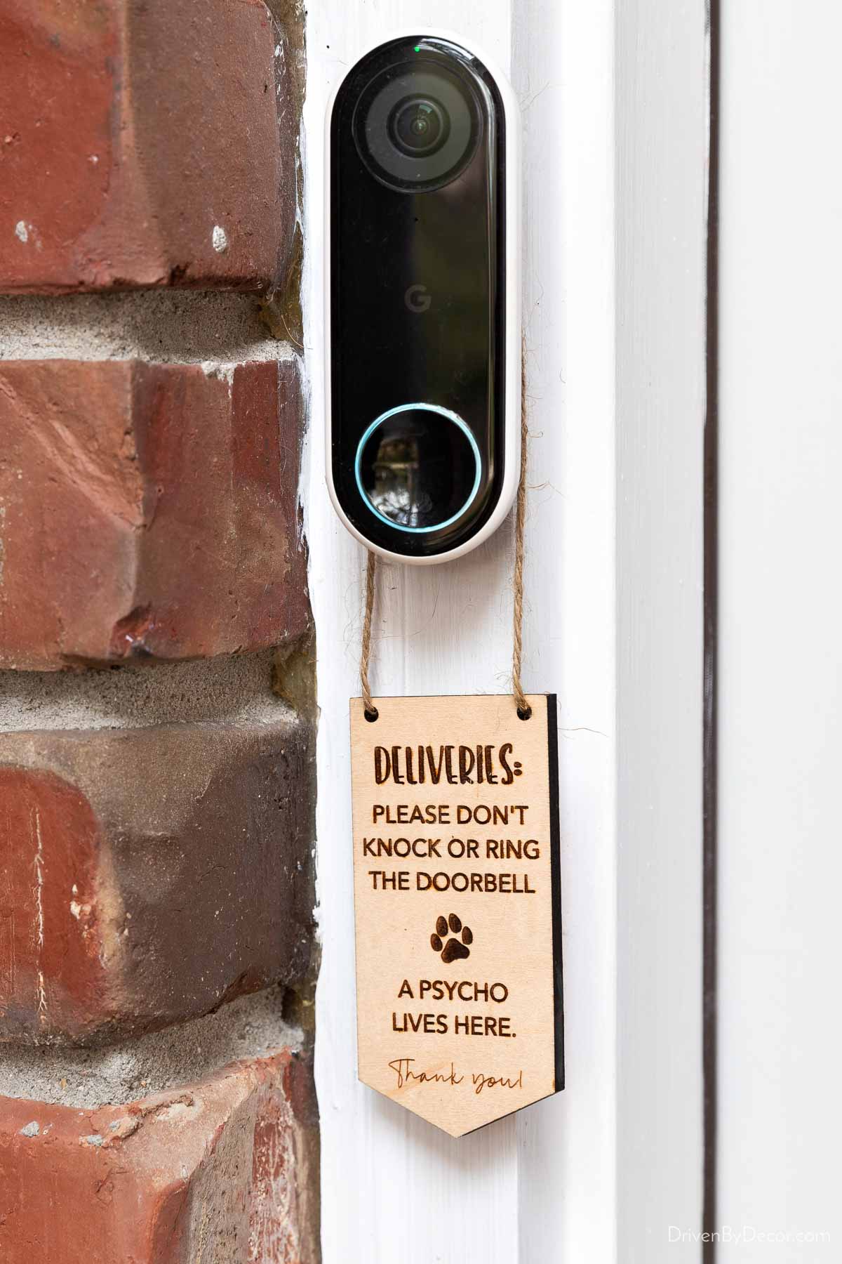 Wood doorbell sign saying not to ring doorbell for deliveries