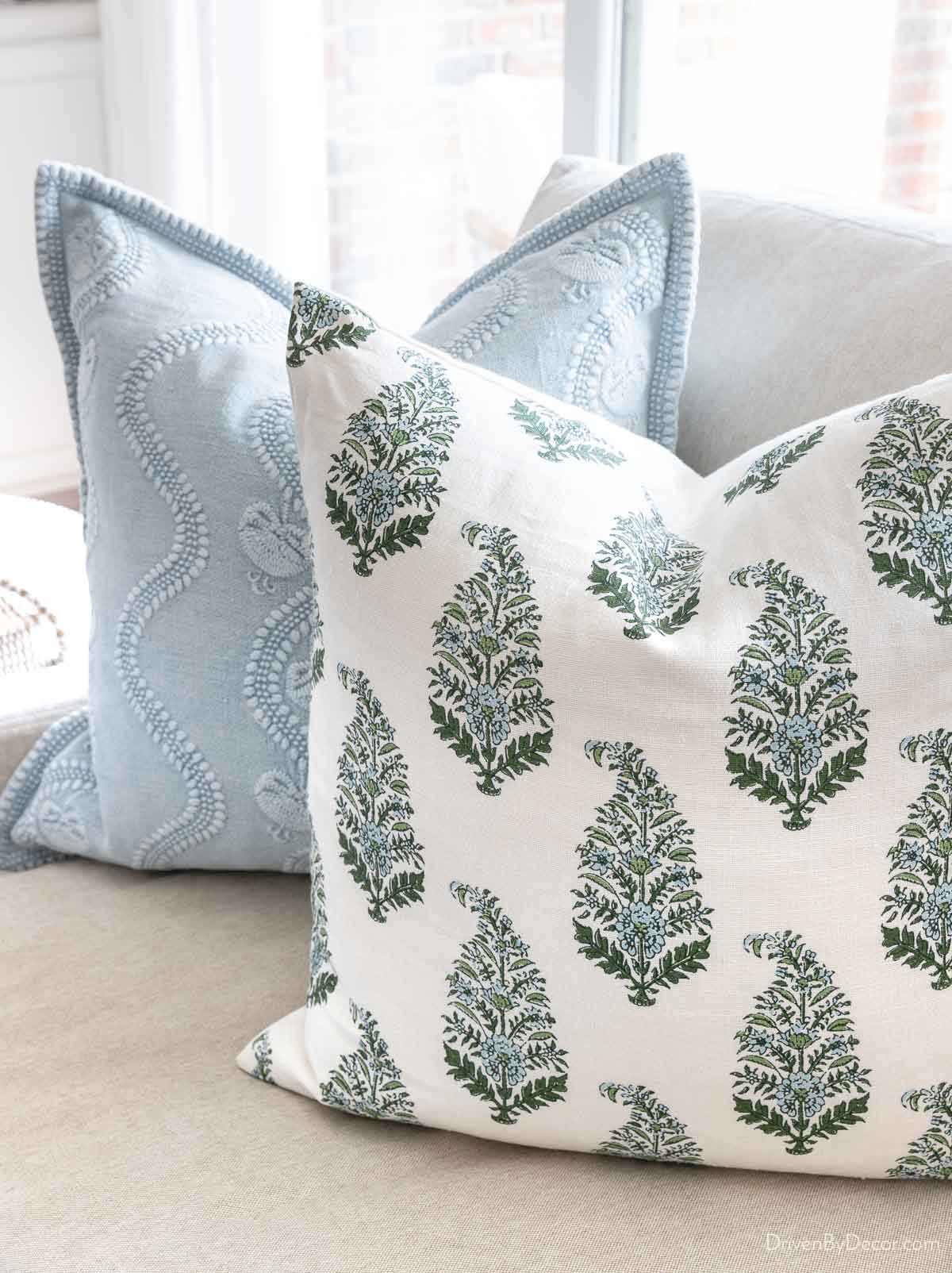 Floral patterned pillow cover from Etsy in green, blue, and cream