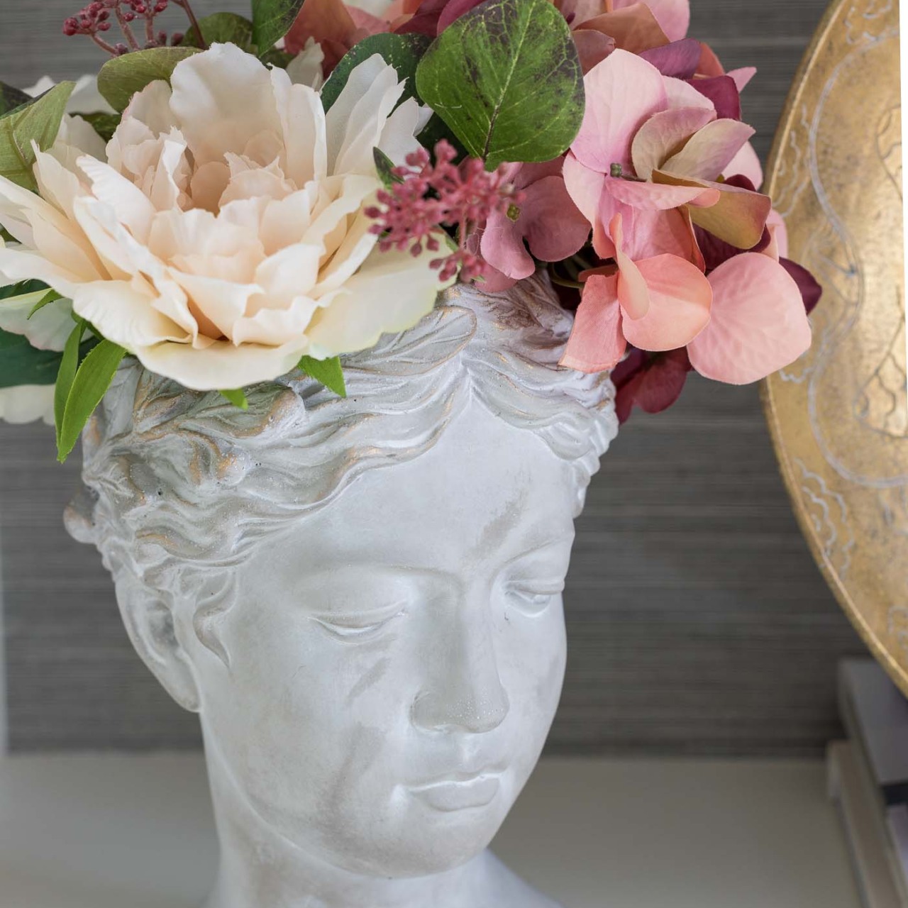 Faux fall flowers in the prettiest bust planter!