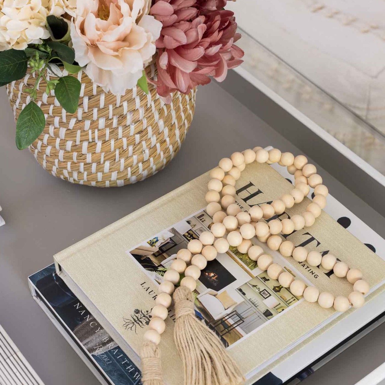Strand of wood beads with tassels as the perfect fall decor for your coffee table!