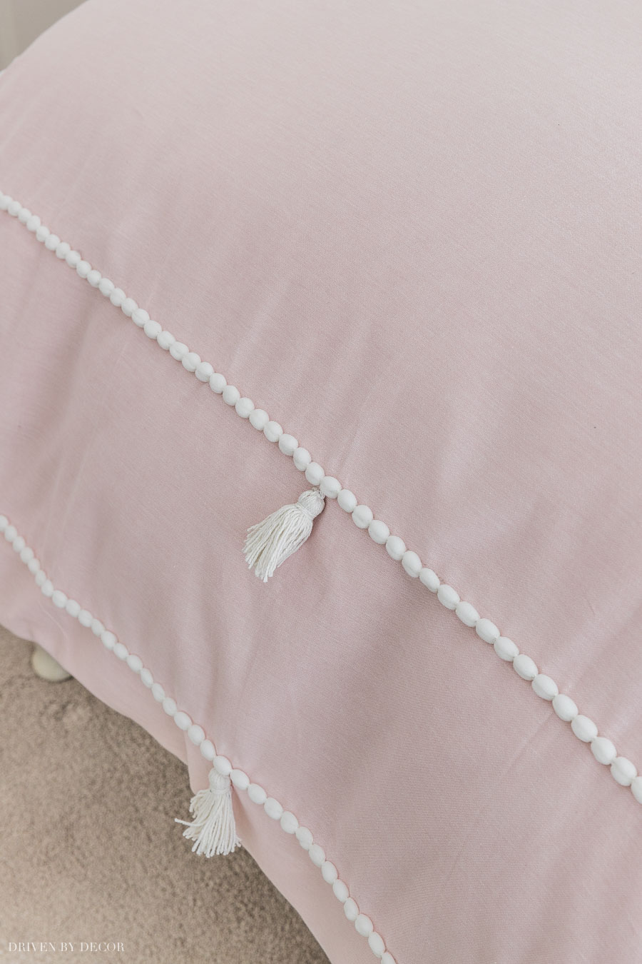 Love this blush duvet with tassels