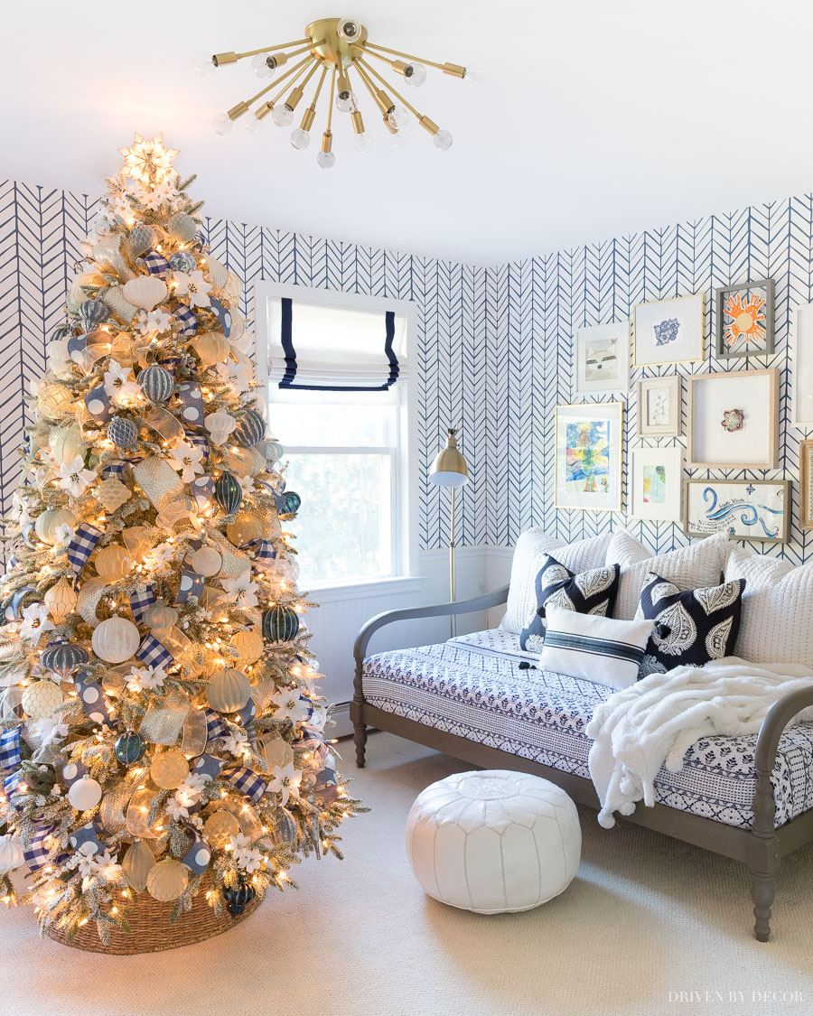 Our Christmas tree decorated with blue and white ribbon and ornaments