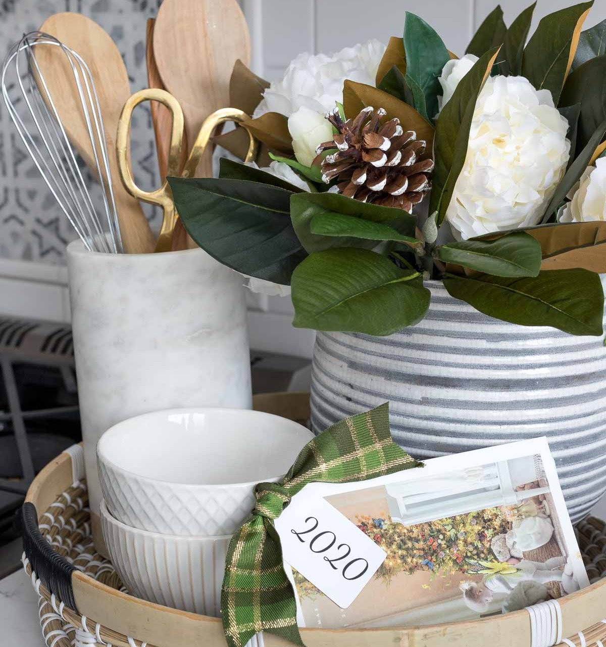 Love this idea for Christmas cards - punch a hole in the corner and tie with ribbon and a tag with the year!