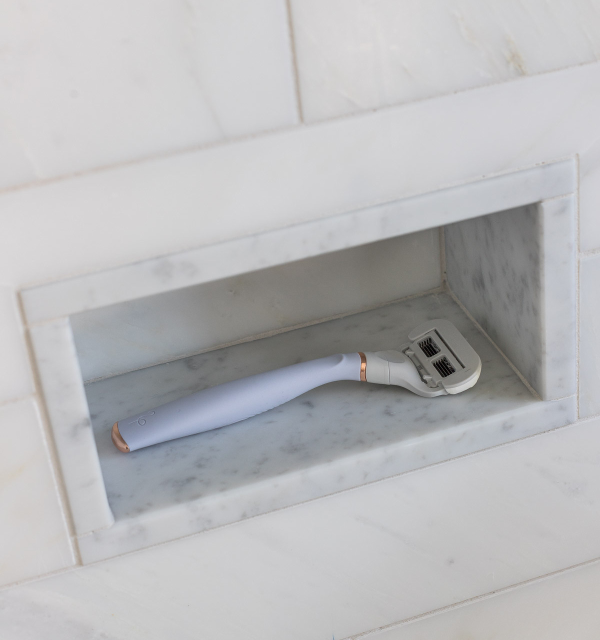 So smart! This small shower niche makes the perfect footrest for shaving!