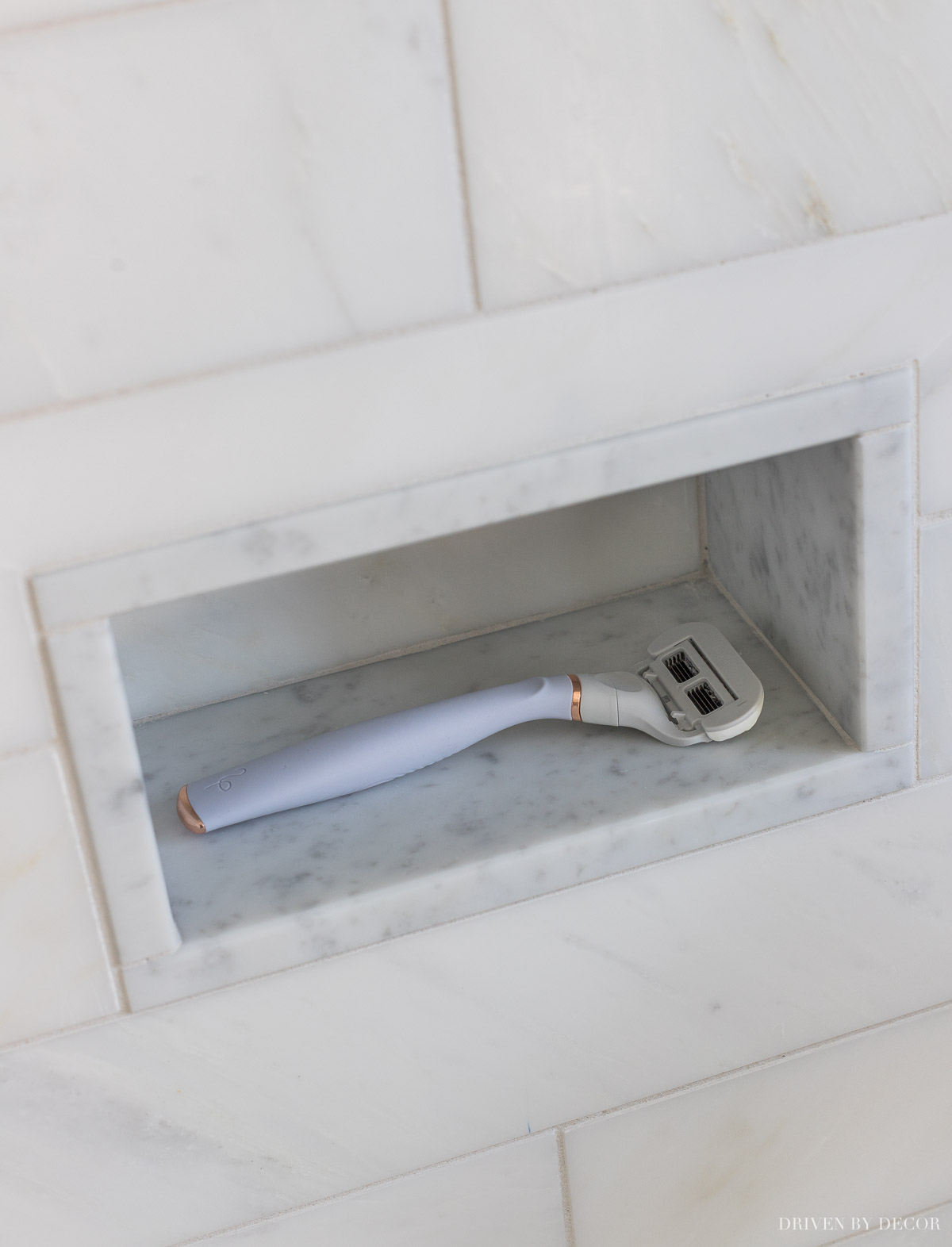 So smart! This small shower niche makes the perfect footrest for shaving!