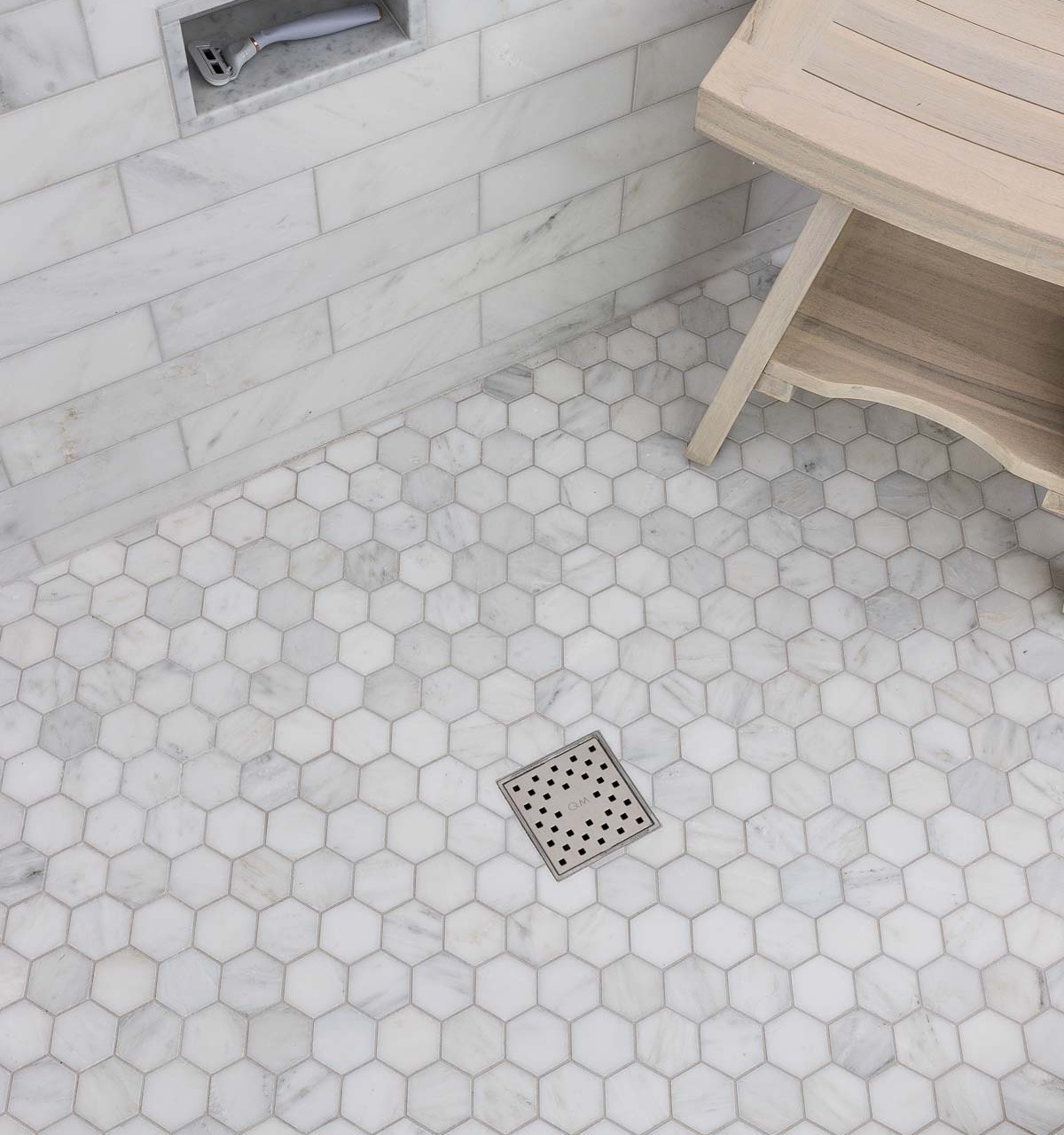 Such a simple master bathroom remodel idea - use a suare drain instead of a circular one!