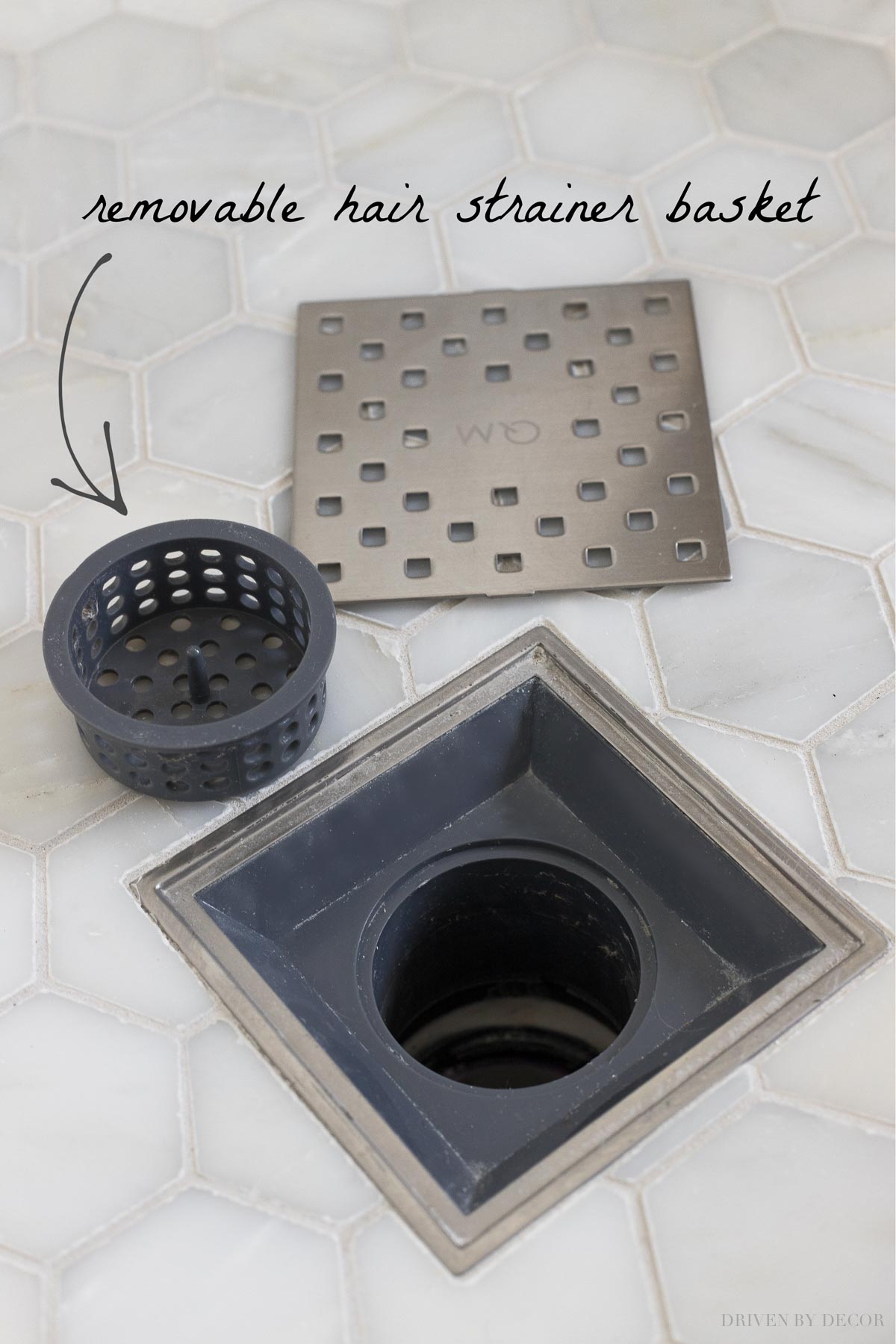 This shower drain has a removable hair strainer basket - such a smart master bathroom remodel idea!