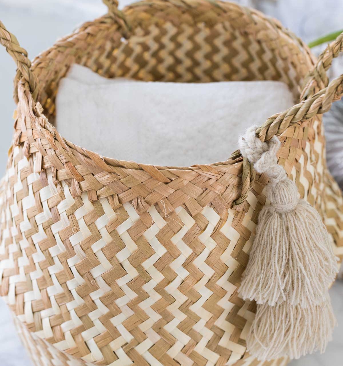 Love this cute basket holding wash cloths on the floating shelves in her master bathroom!
