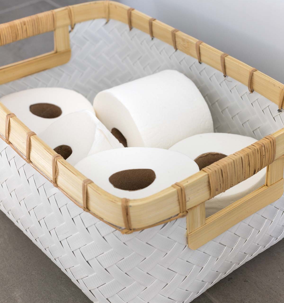 Storage of TP rolls on the floating shelves in this master bathroom remodel