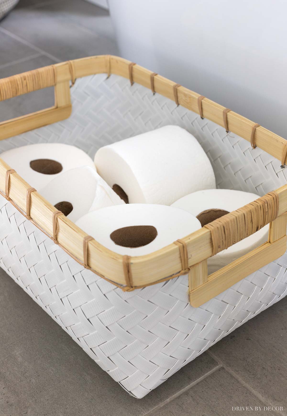 Storage of TP rolls on the floating shelves in this master bathroom remodel