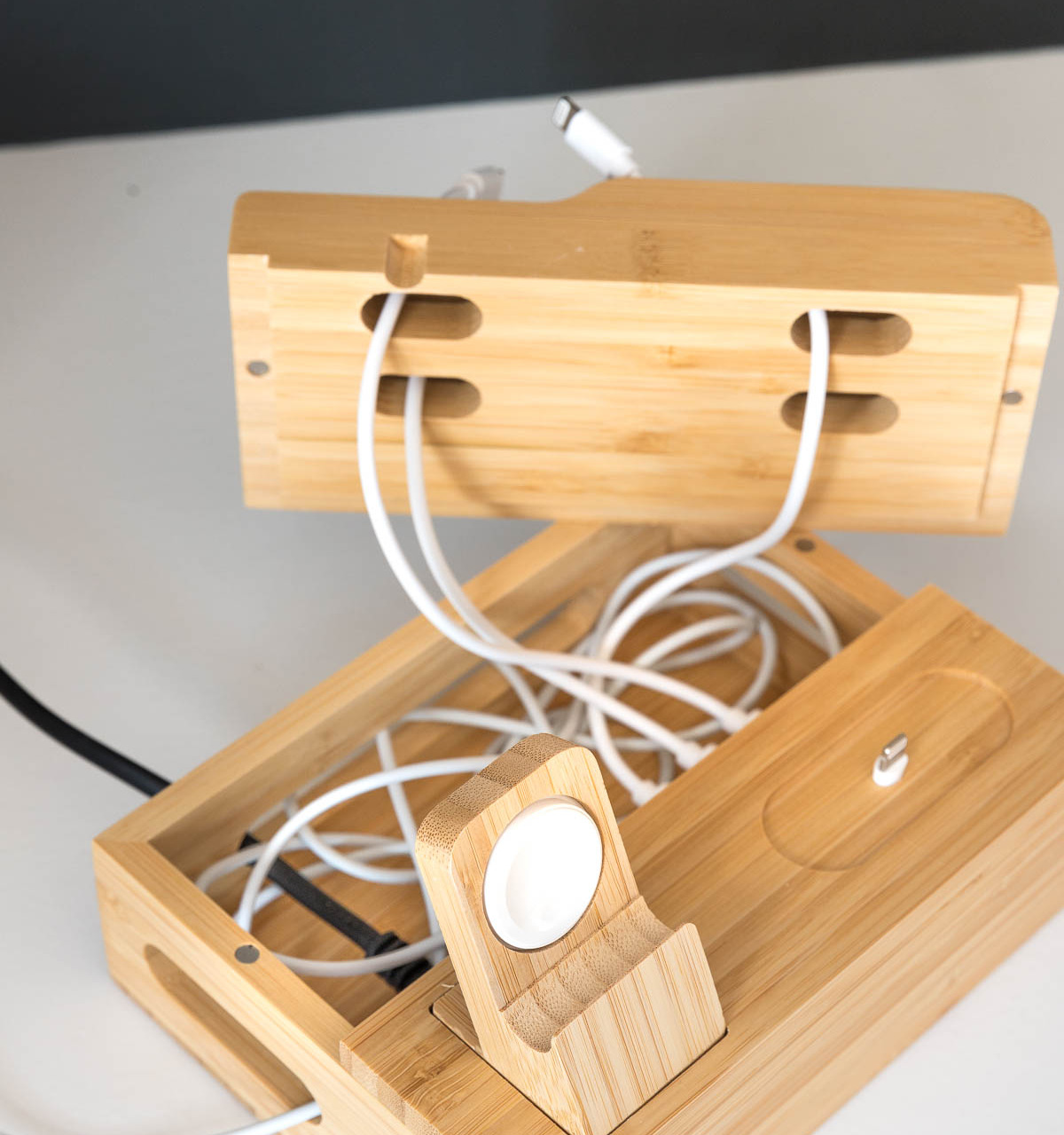 This small charging station is awesome for hiding the mess of charging cords inside!