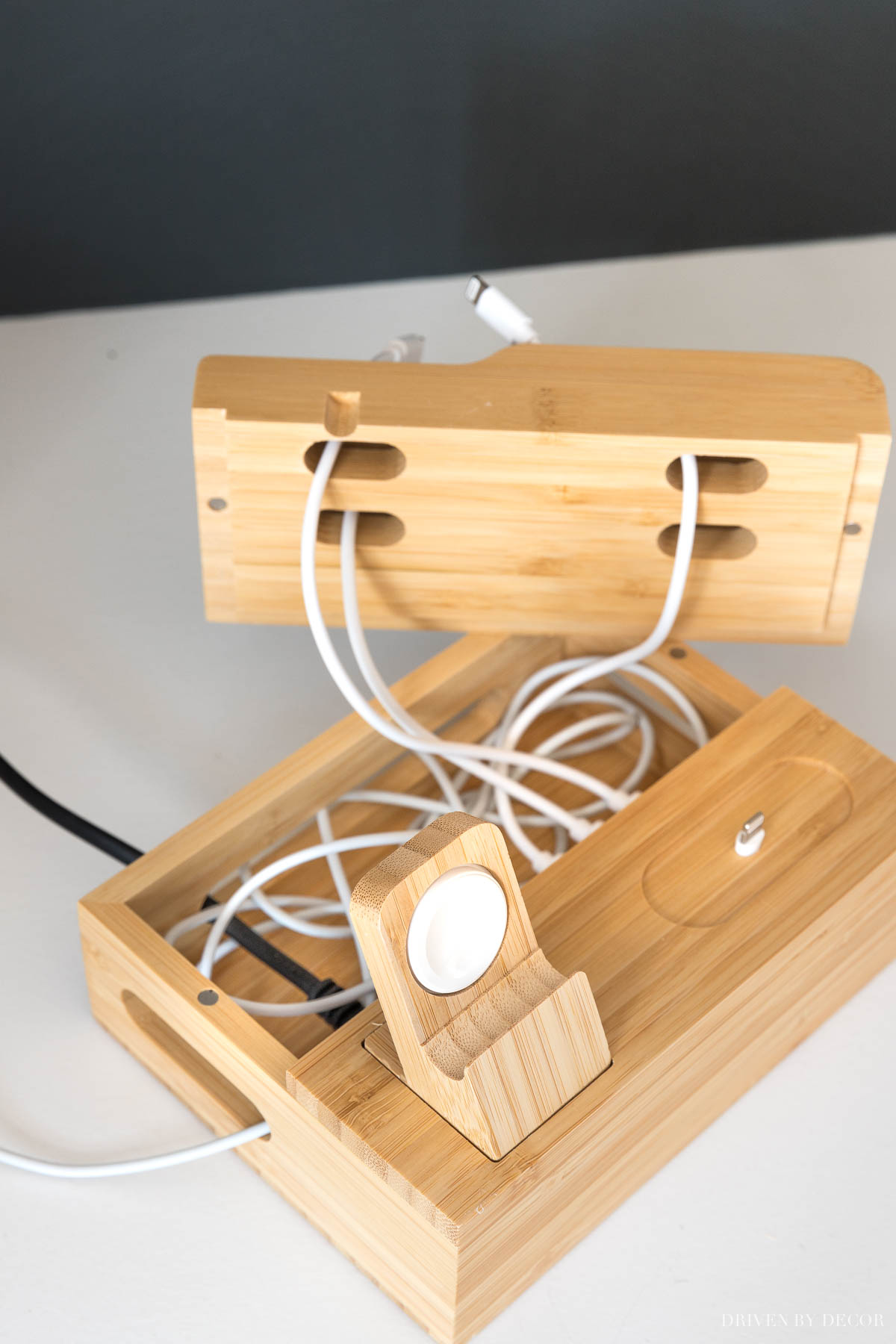 This small charging station is awesome for hiding the mess of charging cords inside!