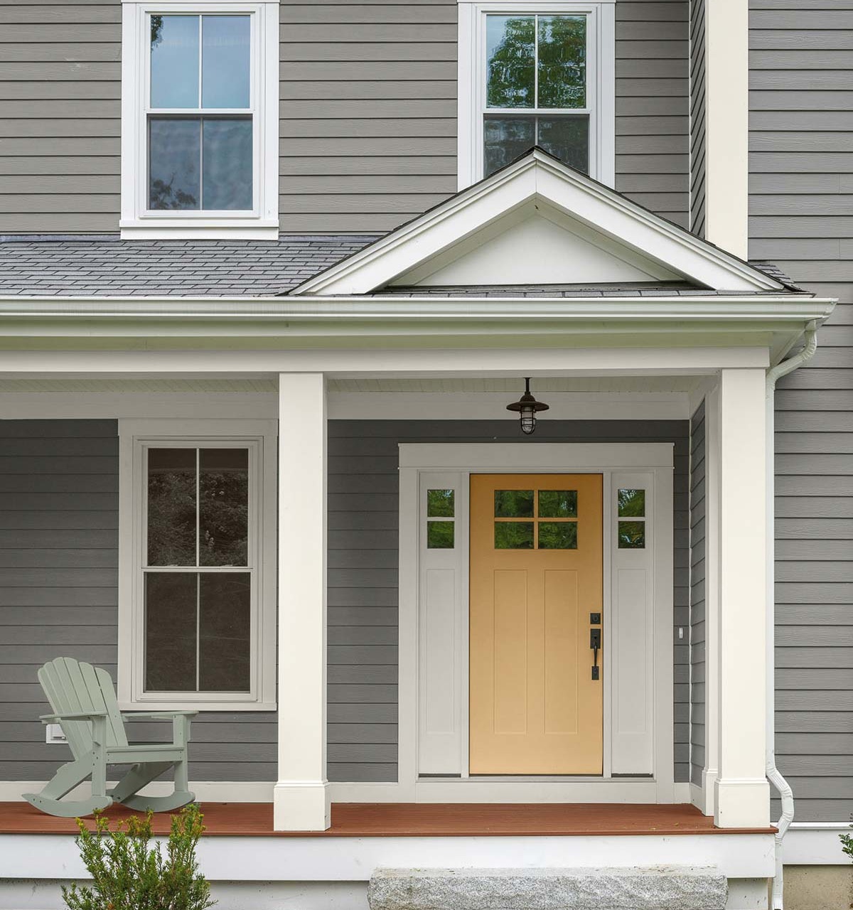 Several of Behr's paint colors of the year are on this home - love the siding and door colors!