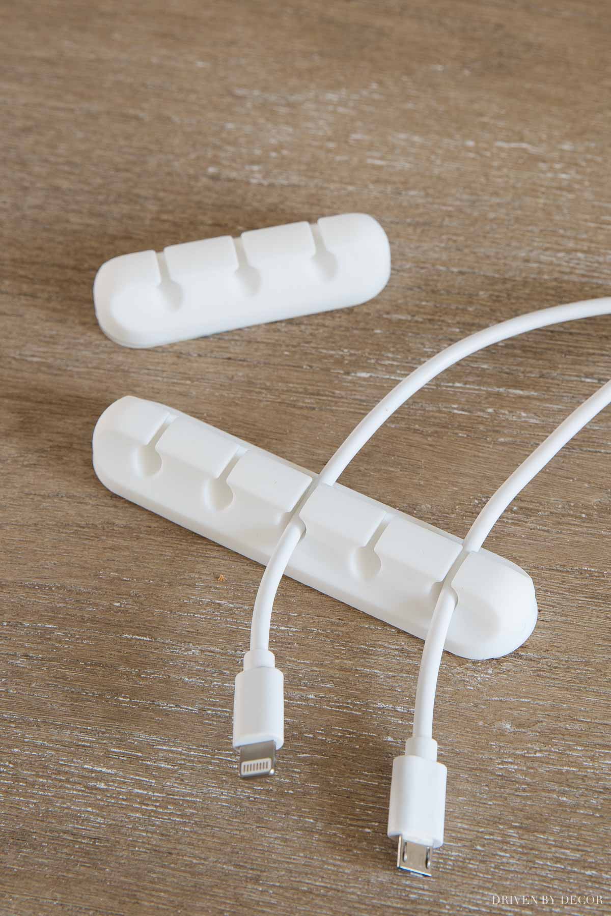 These adhesive cord holders are awesome for keeping cords from slipping behind your desk!