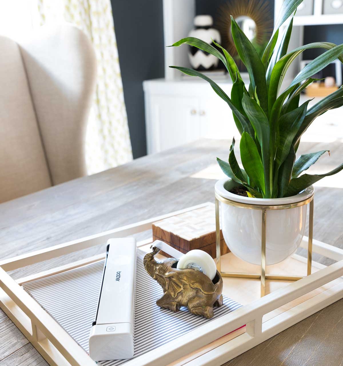 An easy desk organization idea is to have a tray to corral your calendar, paperwork, and most used desk supplies