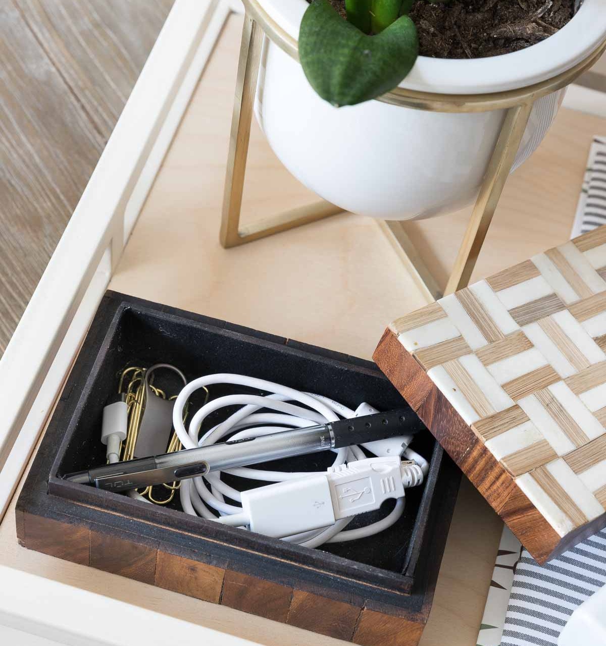 An idea for keeping your desk organized and neat - have a small decorative box for your computer cords, pen, paperclips, and other most-used office supplies
